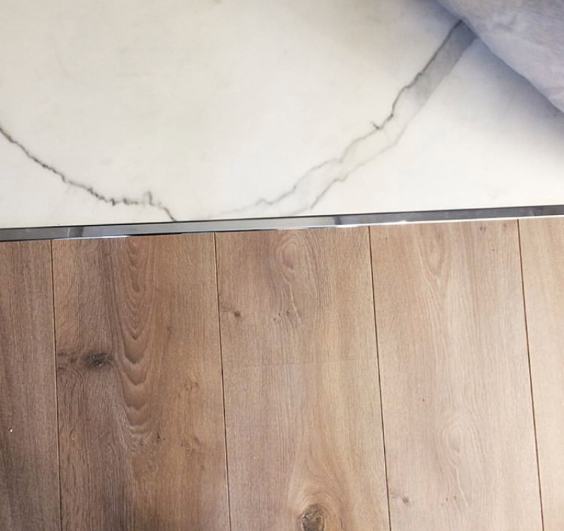 Fayans ve laminat birleşme yerindeki T şeklinde metal profil